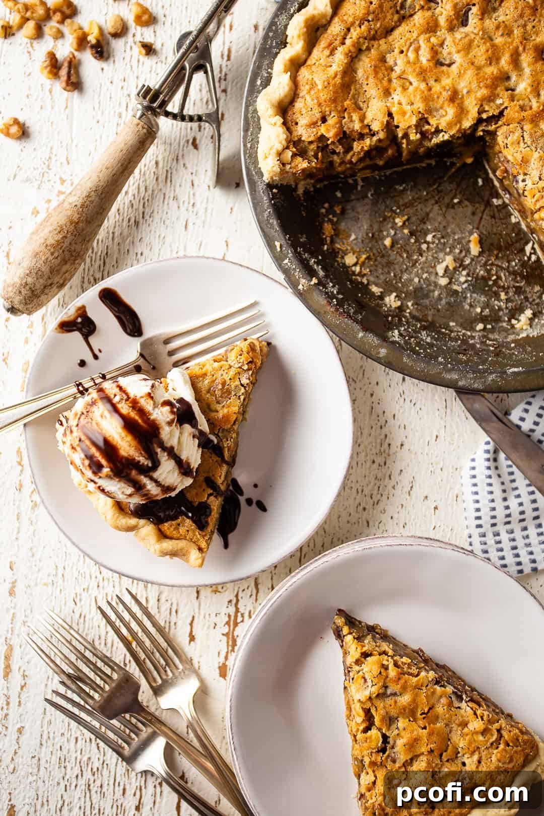 Kentucky derby pie served on white plates with ice cream and chocolate syrup.