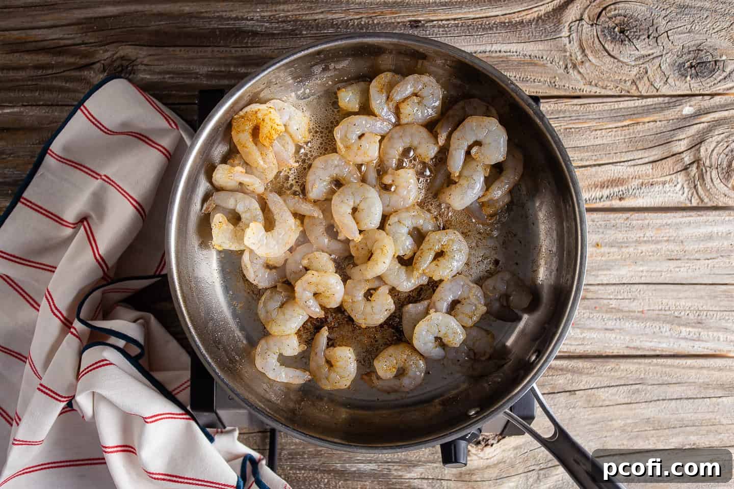 Searing shrimp in bacon fat.