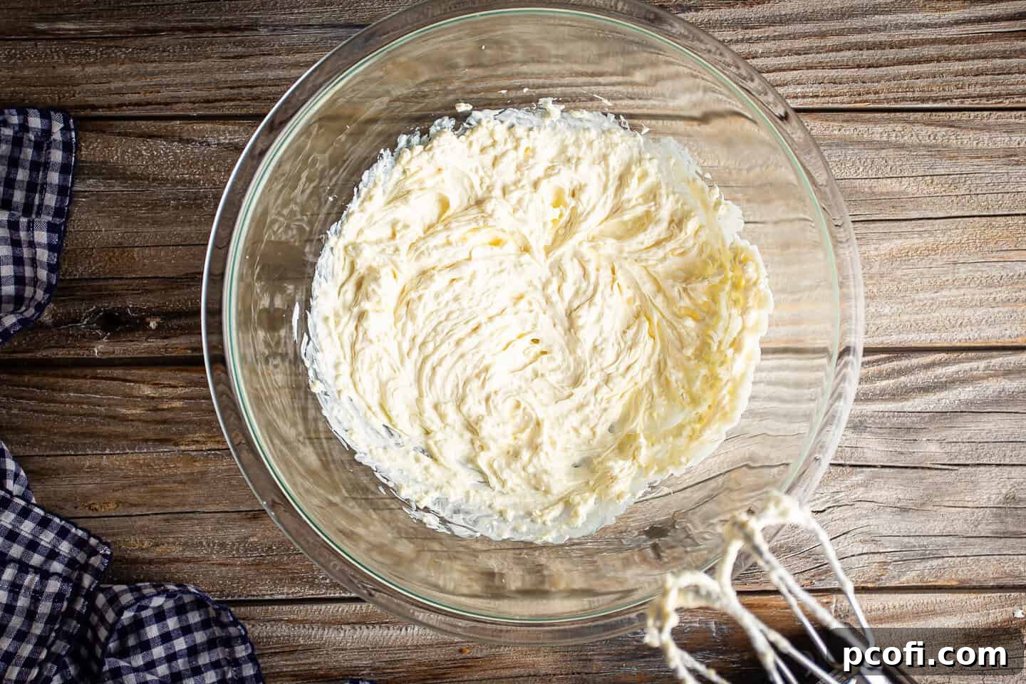 Pimento cheese base mixed together with a handheld electric mixer.