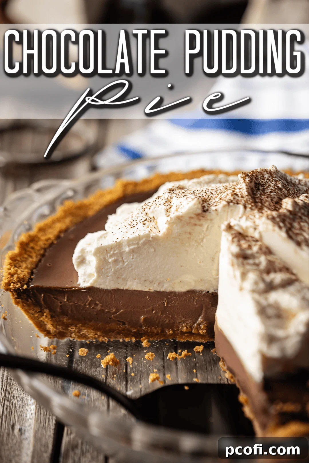 A perfectly sliced homemade chocolate pudding pie, showcasing its creamy interior and golden graham cracker crust, ready for serving.