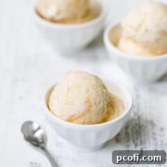 Peach ice cream in three bowls