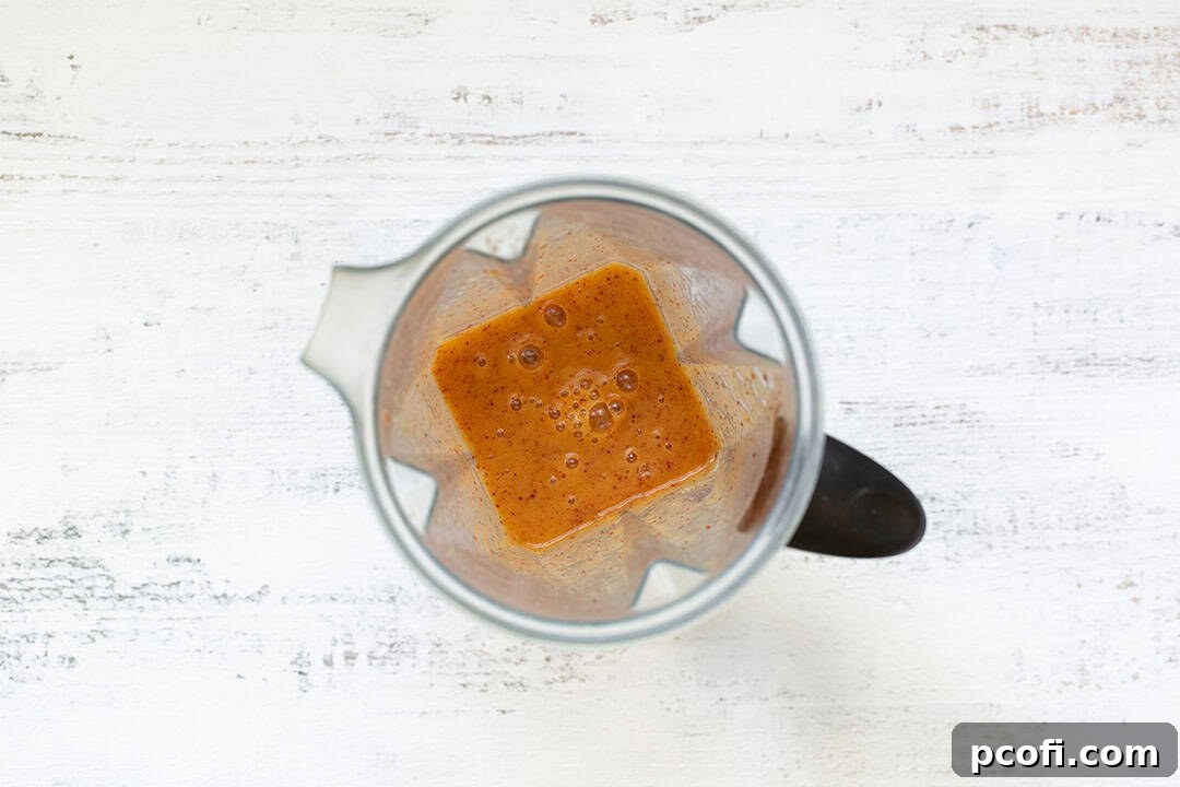 Pureed peaches in a blender, ready for mixing