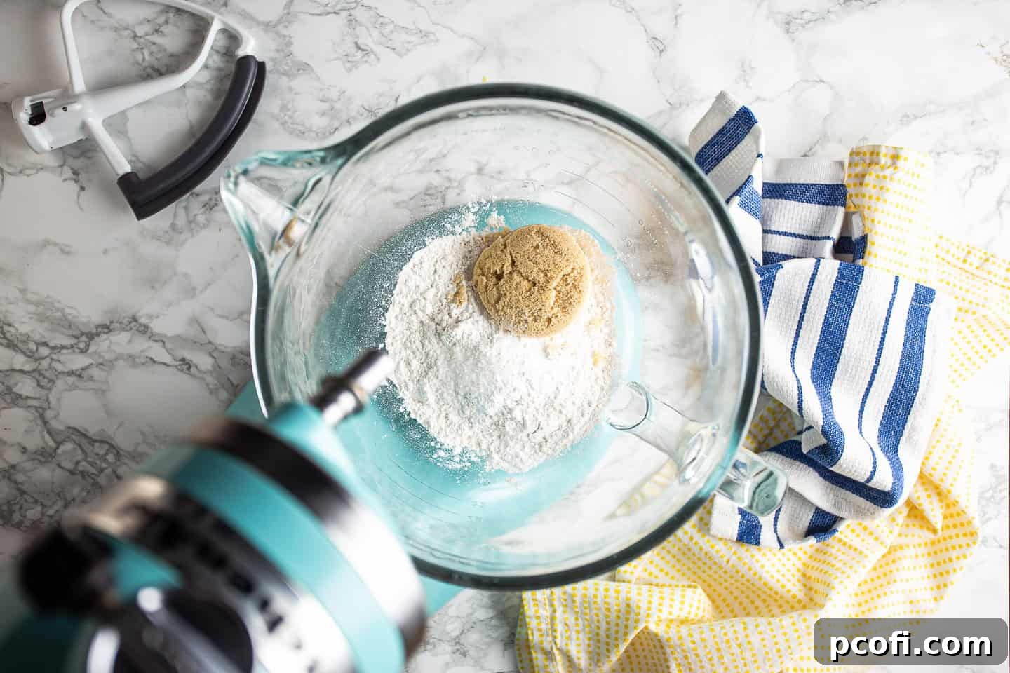 Dry ingredients for butterscotch krimpets, including flour, brown sugar, leavening, and salt, in the bowl of a stand mixer.