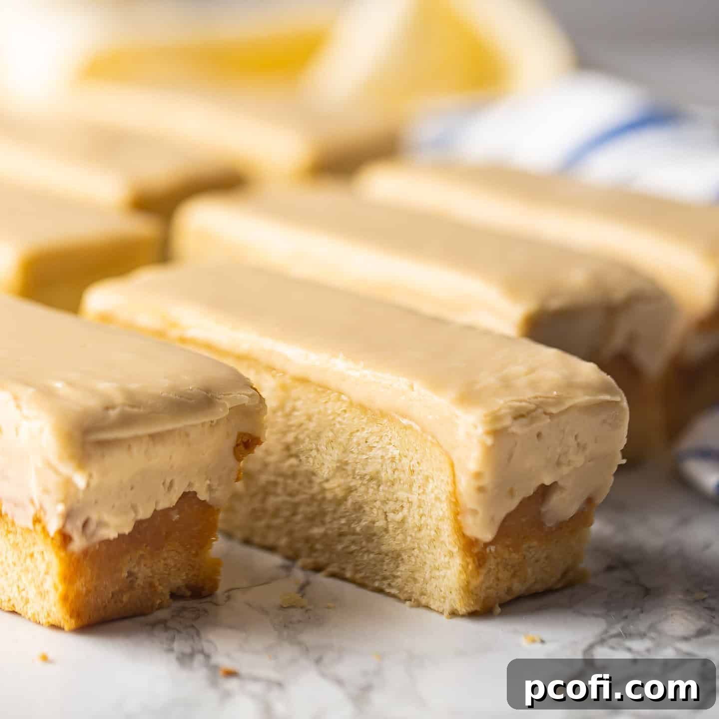 Homemade butterscotch krimpets on a white marble surface.