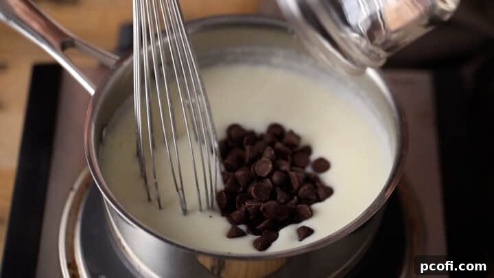 Whisking chocolate chips into the thickened milk mixture.
