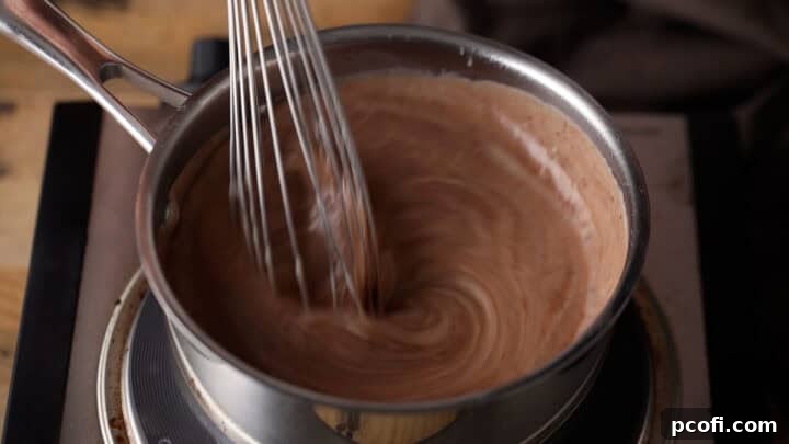 Chocolate chips melting into homemade pudding.