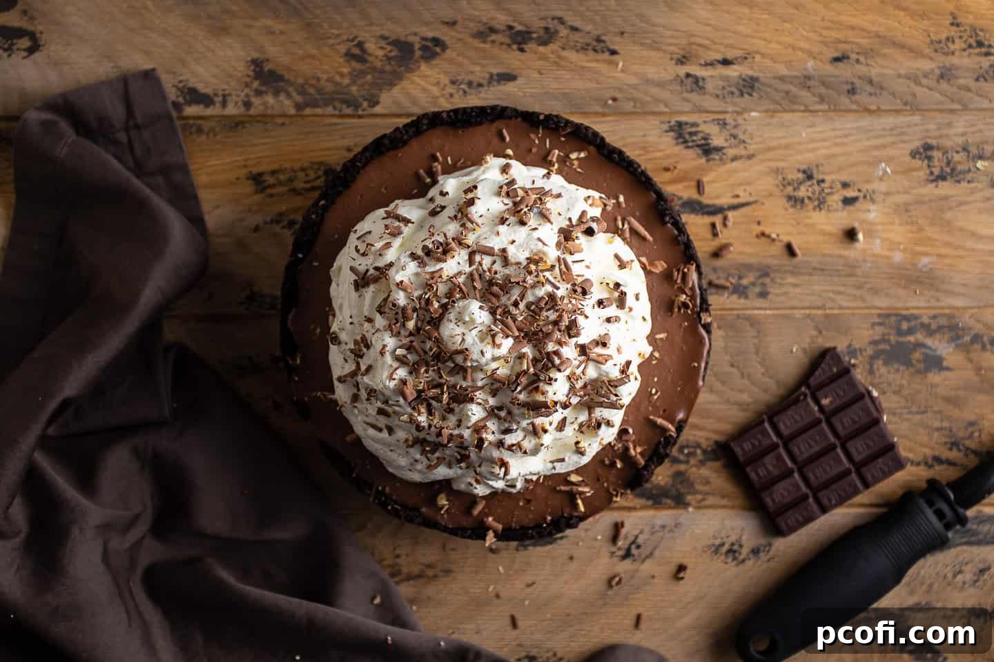 Topping Mississippi mud pie with chocolate shavings.