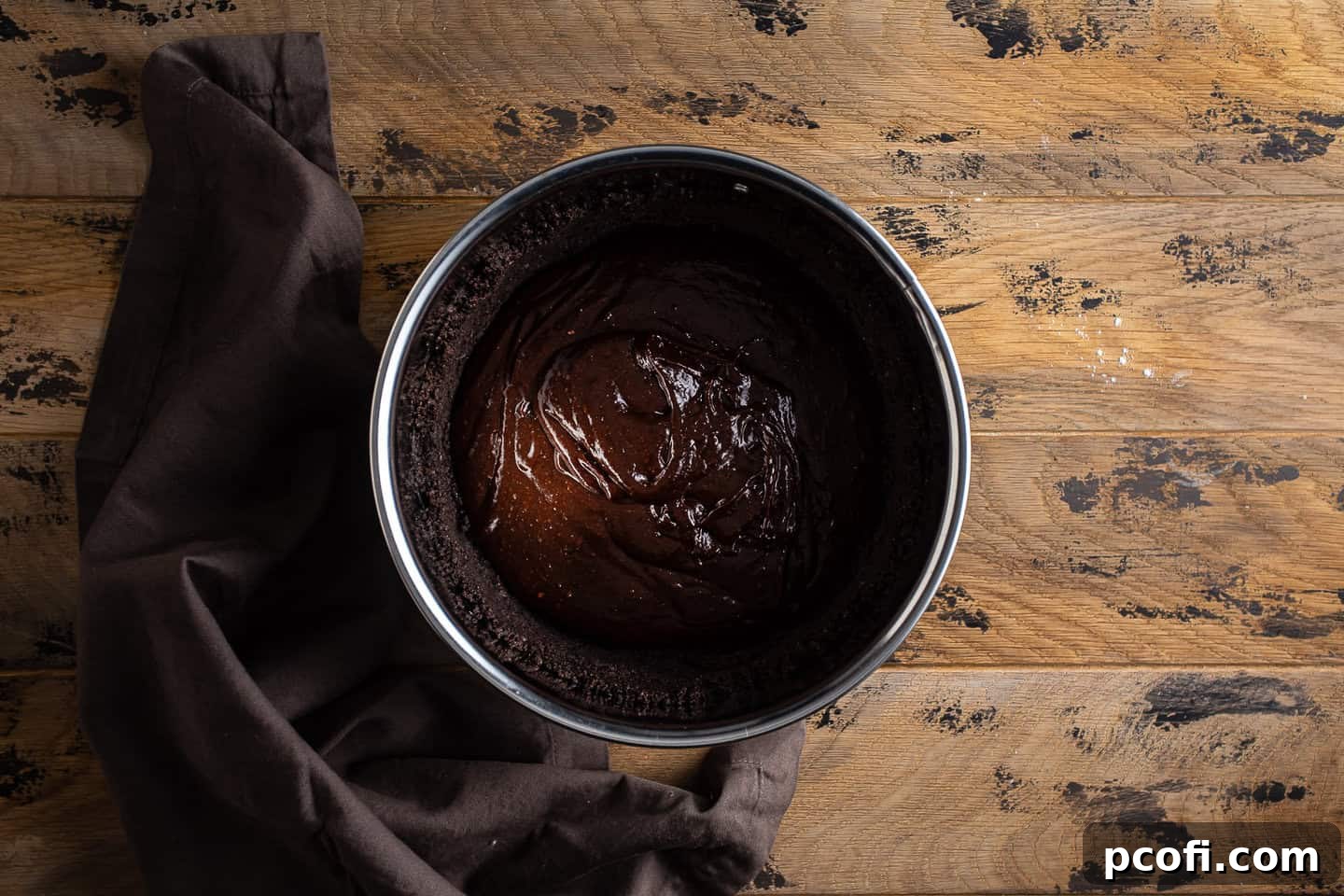 Baking brownie batter in Oreo crust.