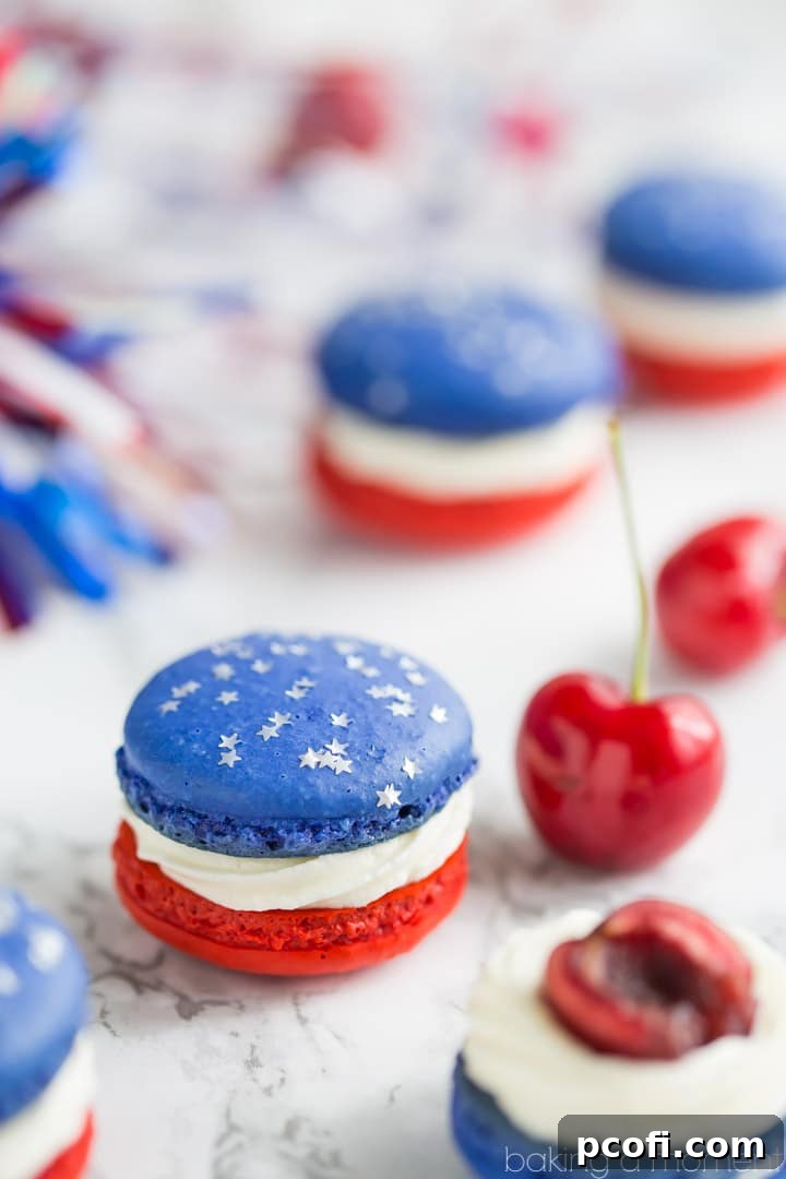 Vibrantly colored red, white, and blue cherry cheesecake macarons, showcasing patriotic hues and delicate textures, perfect for celebrations.