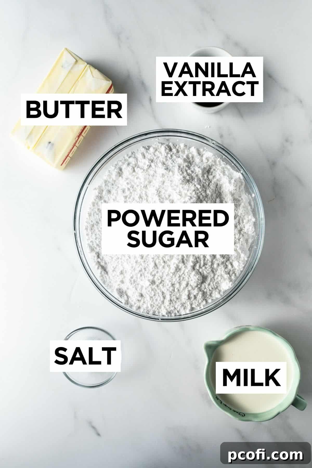 Ingredients for vanilla frosting for an American flag cake, showcasing softened butter, powdered sugar, and vanilla extract in separate bowls on a white table.