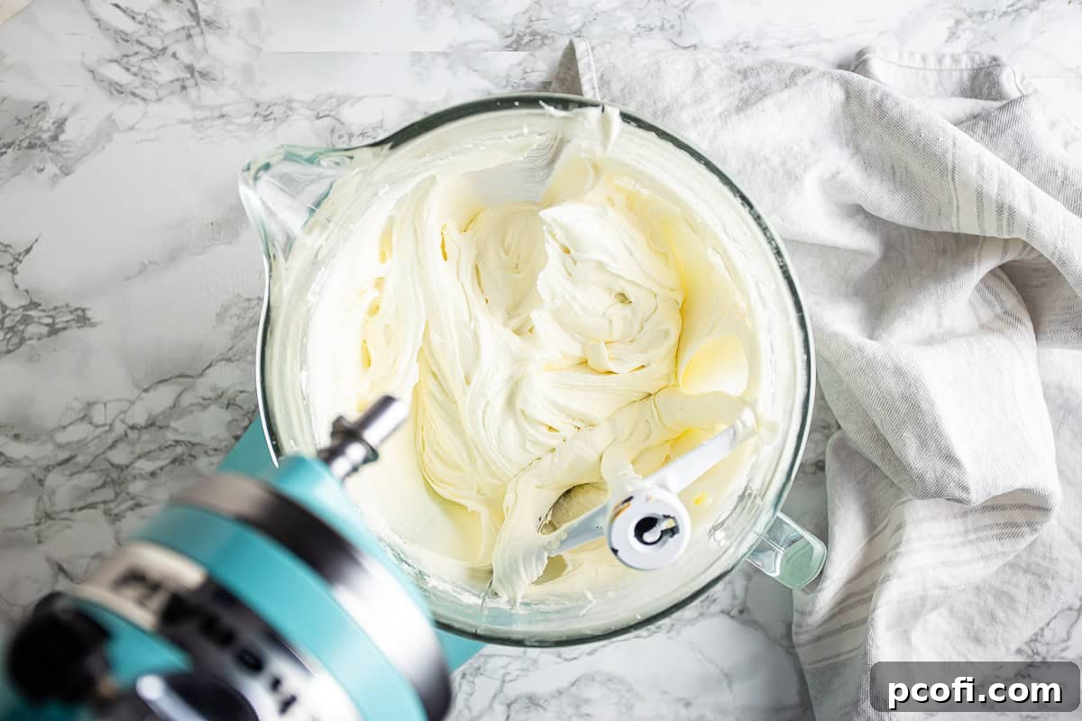 Cream cheese, butter, and sugar that have been creamed together until pale and fluffy.