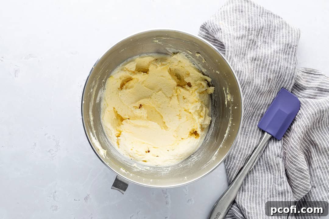 Butter, sugar, vanilla and eggs whipped together in a mixing bowl.