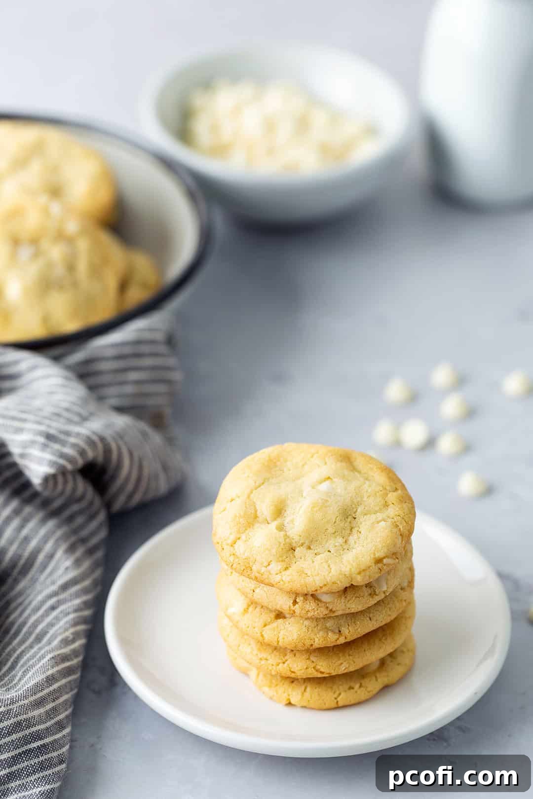 A stack of cookies on a plate.