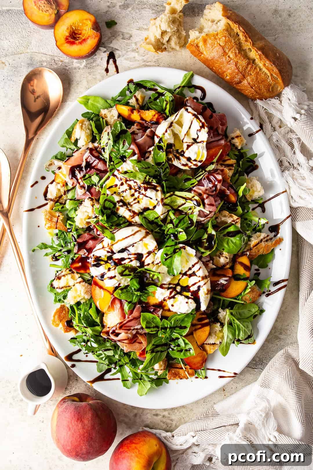 Overhead image of caprese salad with peaches drizzled with balsamic glaze, ready to be served.