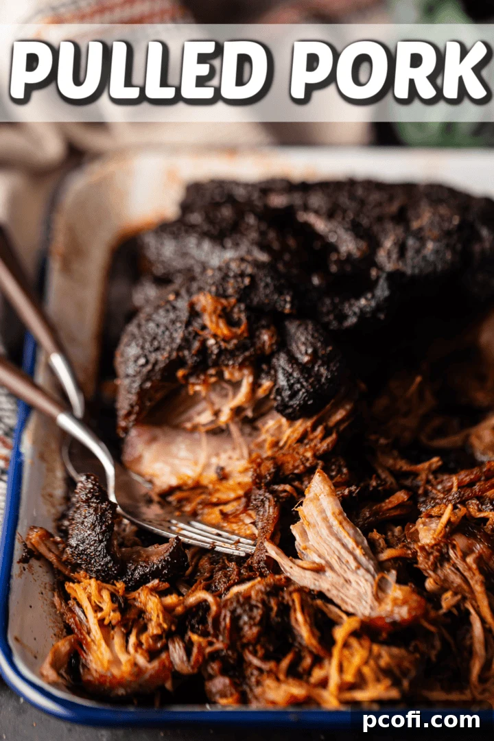A tray of pulled pork with lots of crusty bark.