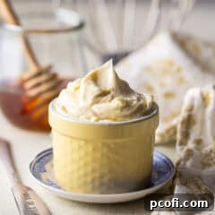 Whipped honey butter in a small hobnail ramekin.