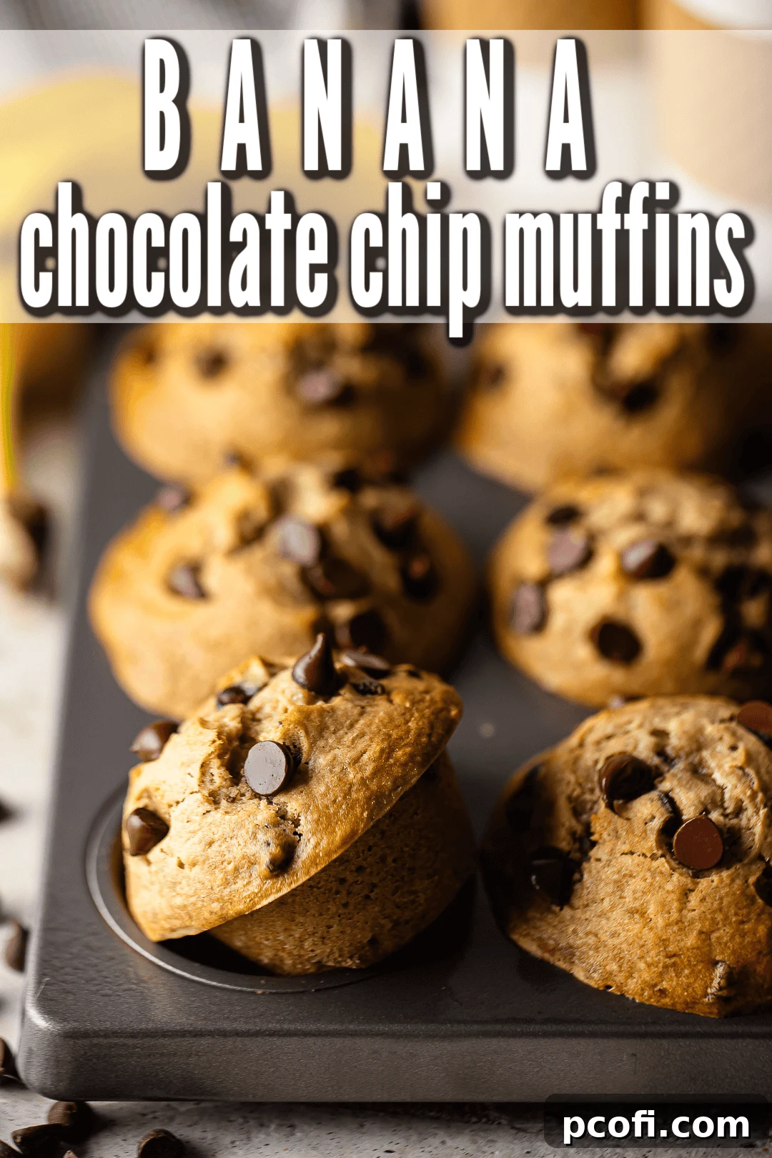 Delicious chocolate chip banana muffins arranged in a pan, surrounded by ripe bananas, ready to be enjoyed.