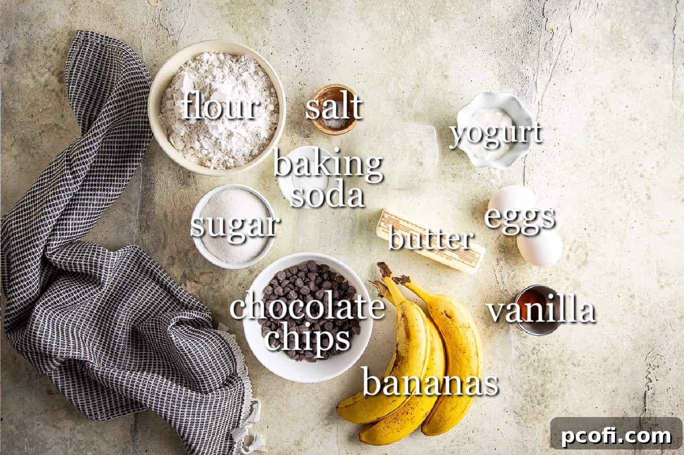 Key ingredients for making banana chocolate chip muffins laid out with clear labels.
