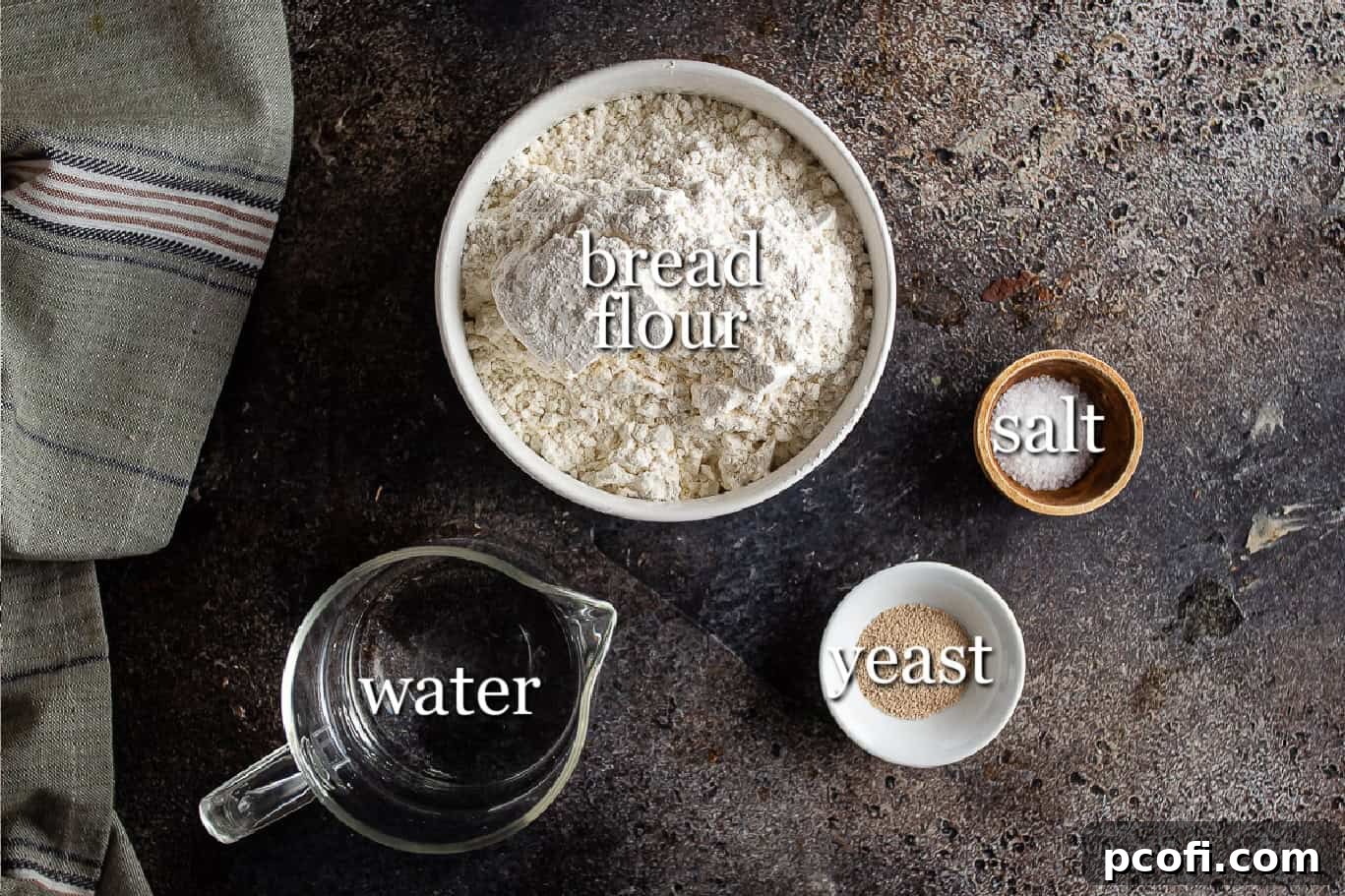 Ingredients for making pan de cristal bread, including bread flour, water, active dry yeast, and kosher salt, with labels.