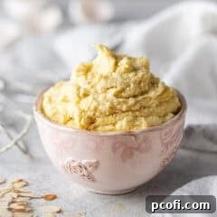 Freshly made frangipane filling in a small pink bowl.