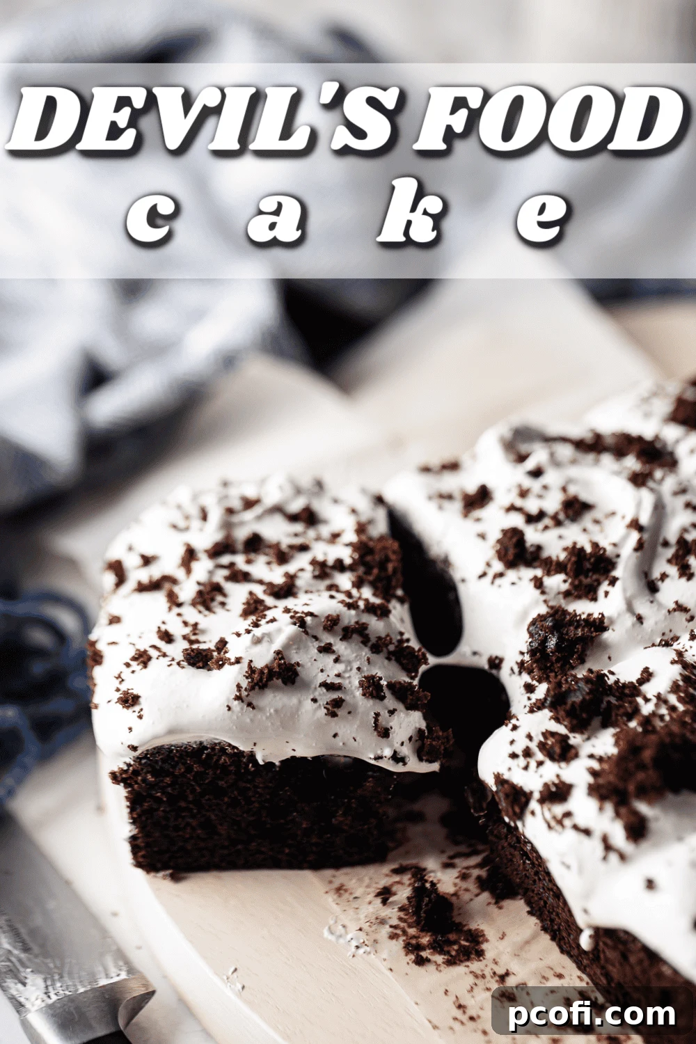 Devils food cake cut into squares and garnished with chocolate cake crumbs.