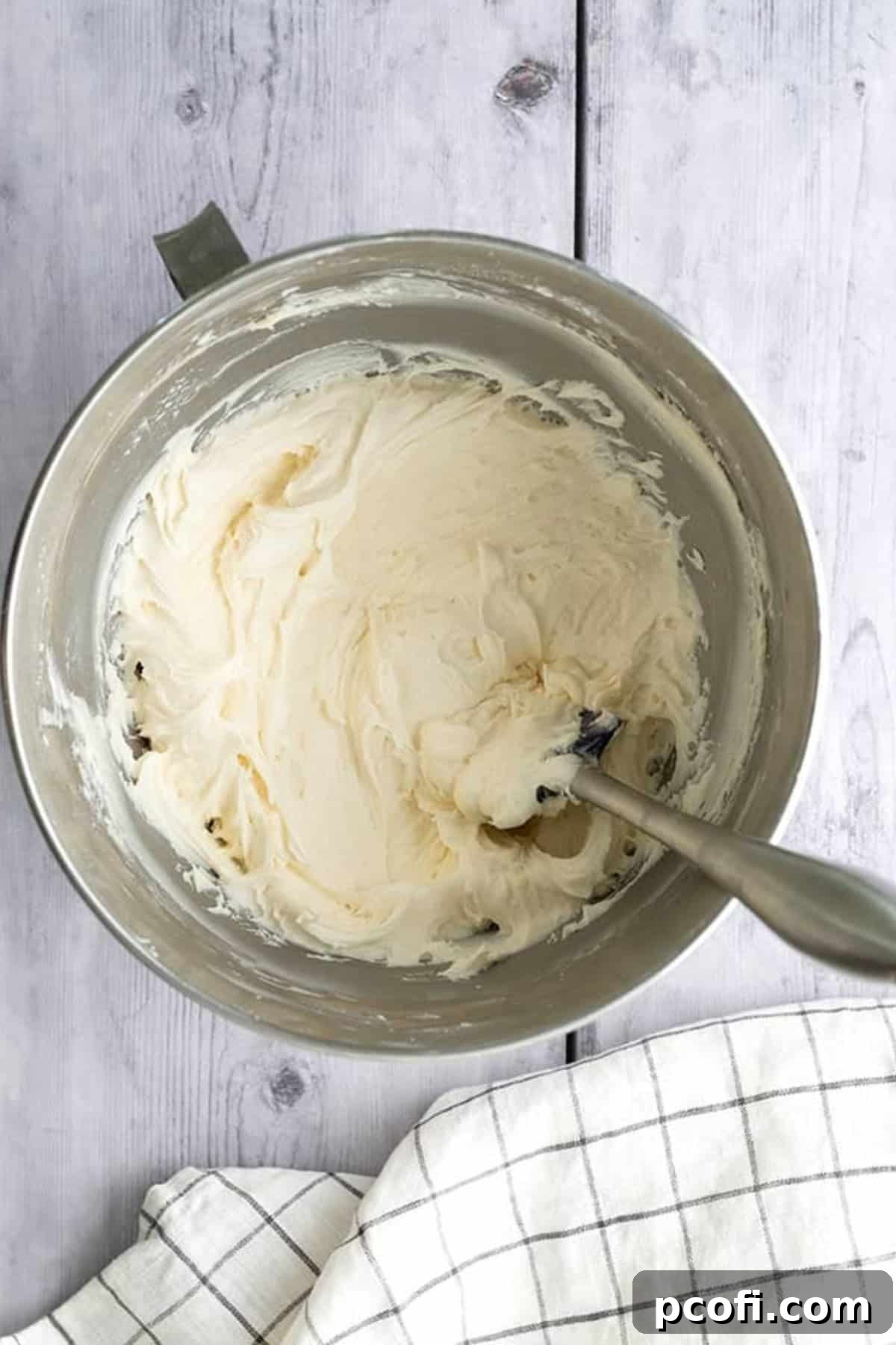 vanilla buttercream frosting in a stand mixer bowl.