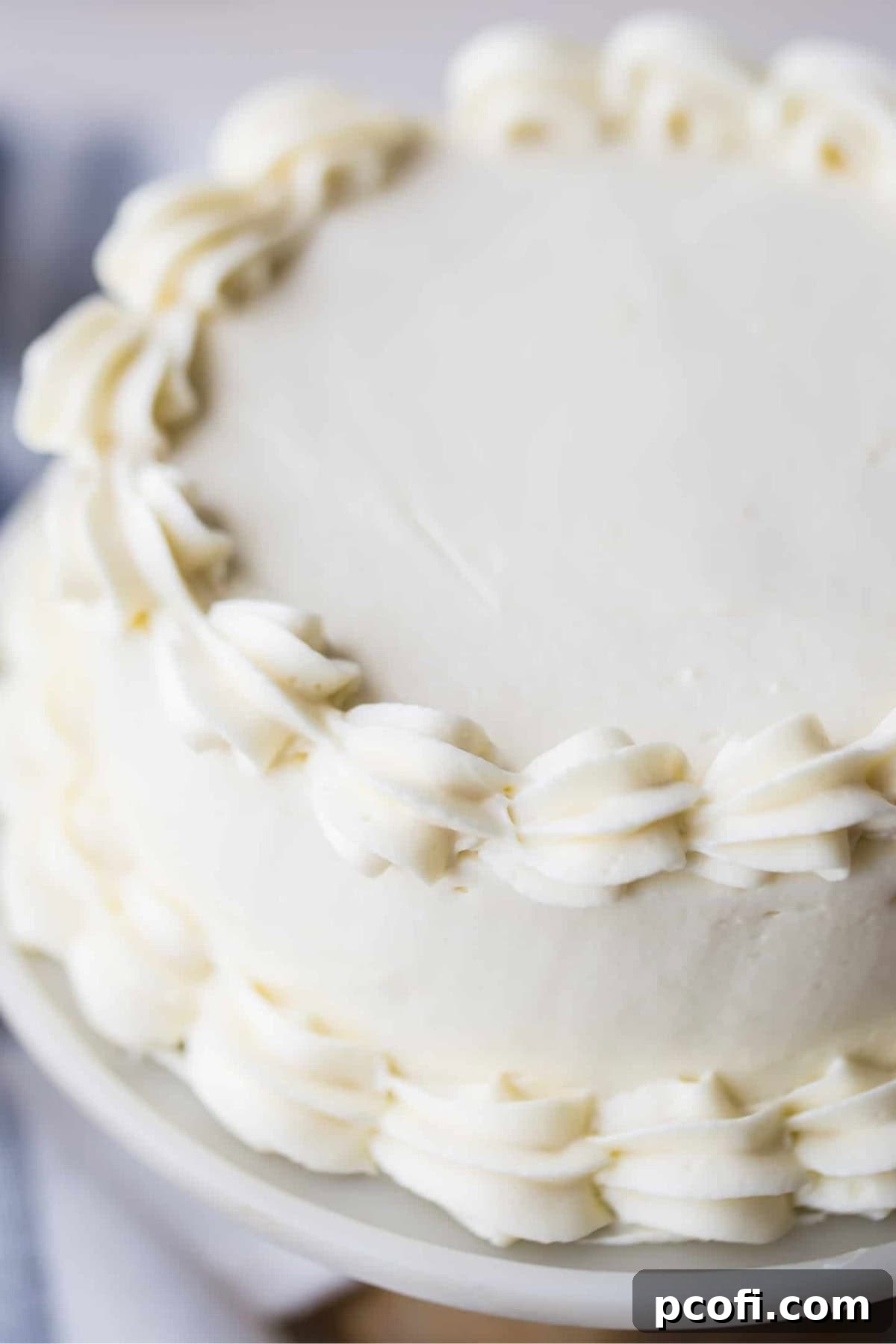 vanilla buttercream frosting piped onto a cake.