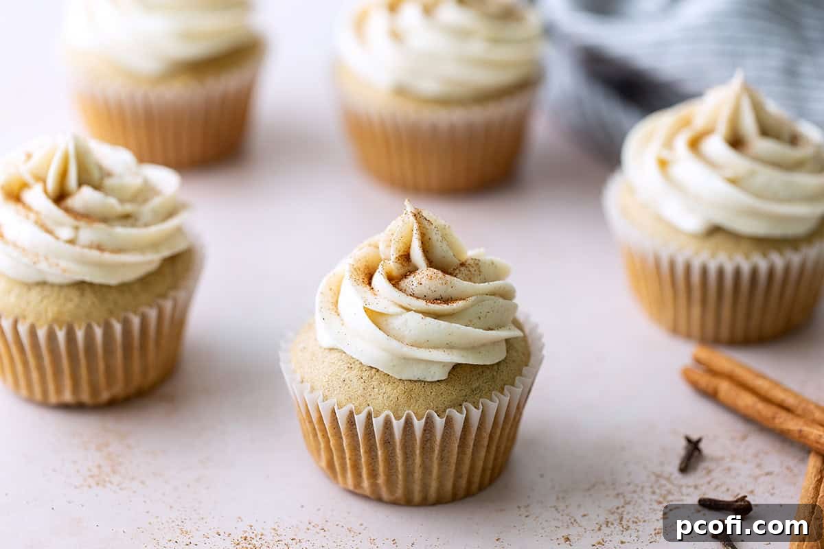 Closeup of chai spice cupcakes, highlighting the intricate flavors and festive presentation.