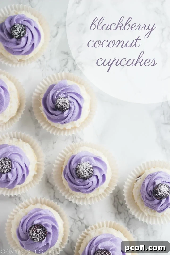 Blackberry Coconut Cupcakes: light, fluffy, and bursting with tropical flavor. A surprise blackberry filling makes them extra special.