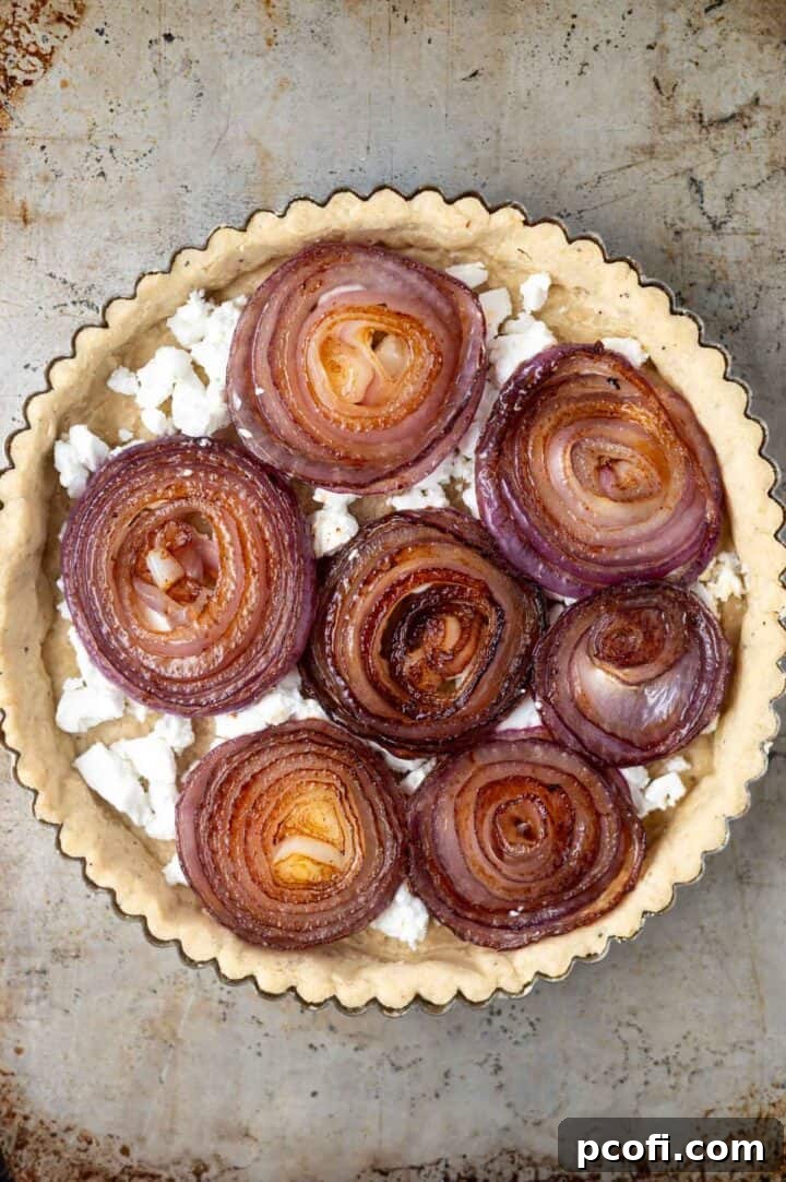 caramelized onion slices and goat cheese in the pre baked tart crust