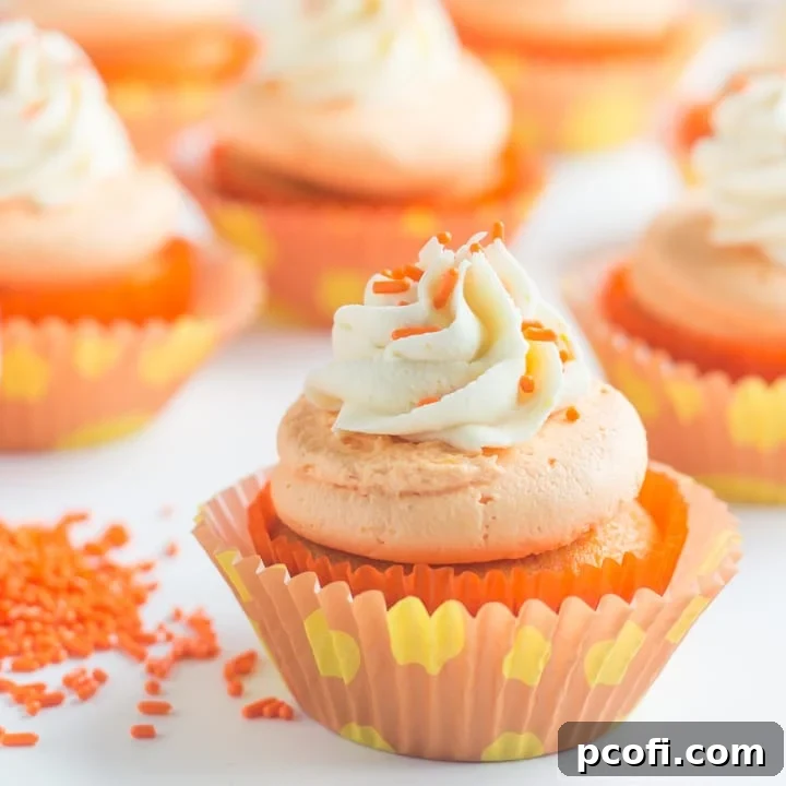 Bright and colorful Orange Creamsicle Cupcakes, a perfect summer treat.
