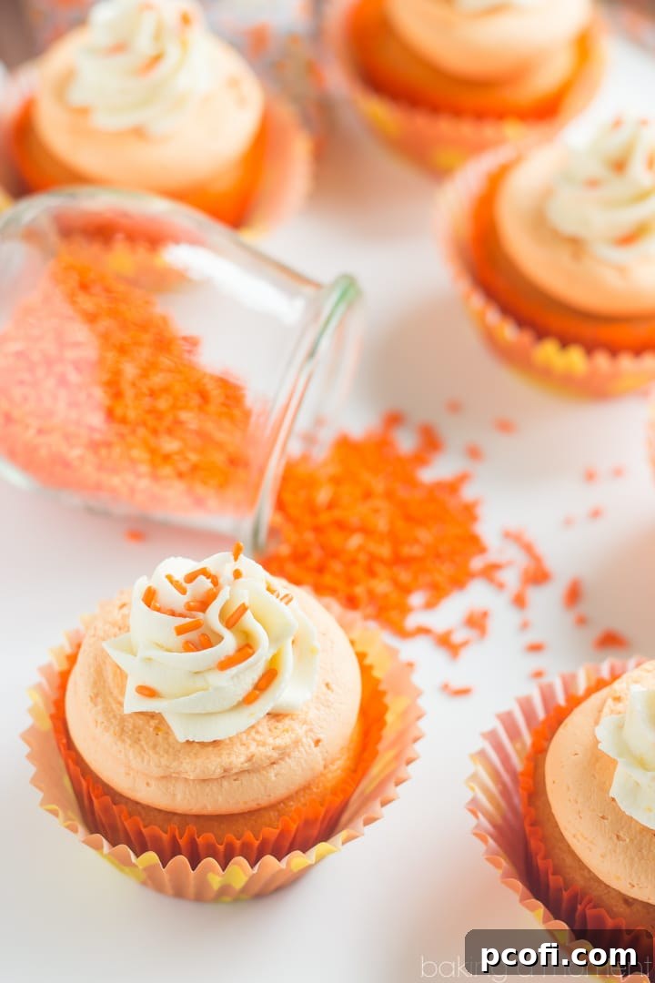 Beautifully piped Orange Creamsicle Cupcakes, ready to be enjoyed.