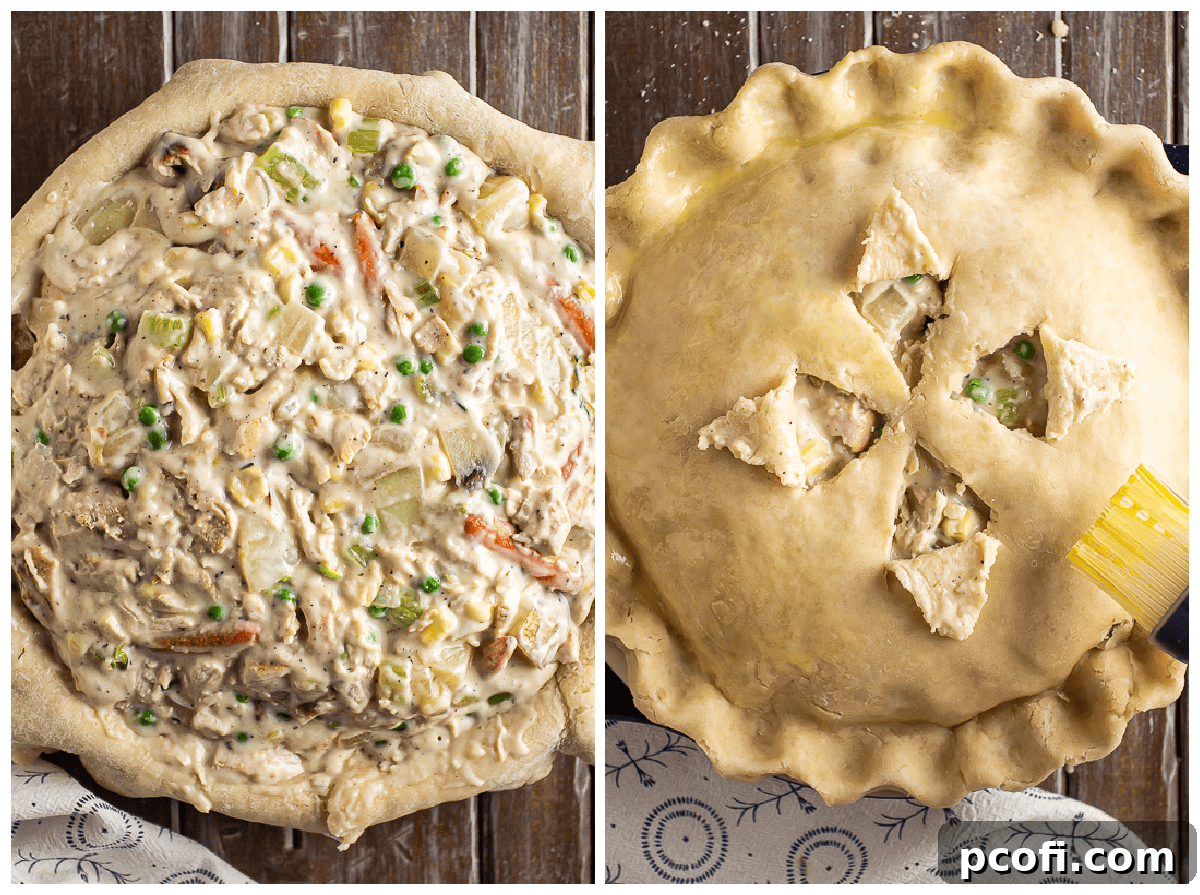 The turkey pot pie filling carefully poured into a pie crust-lined dish, topped with a second pastry crust, and edges crimped.
