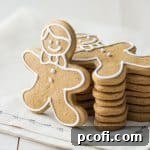Perfectly baked gingerbread cookies, featuring neat edges and traditional holiday shapes, inviting a festive touch to your baking.