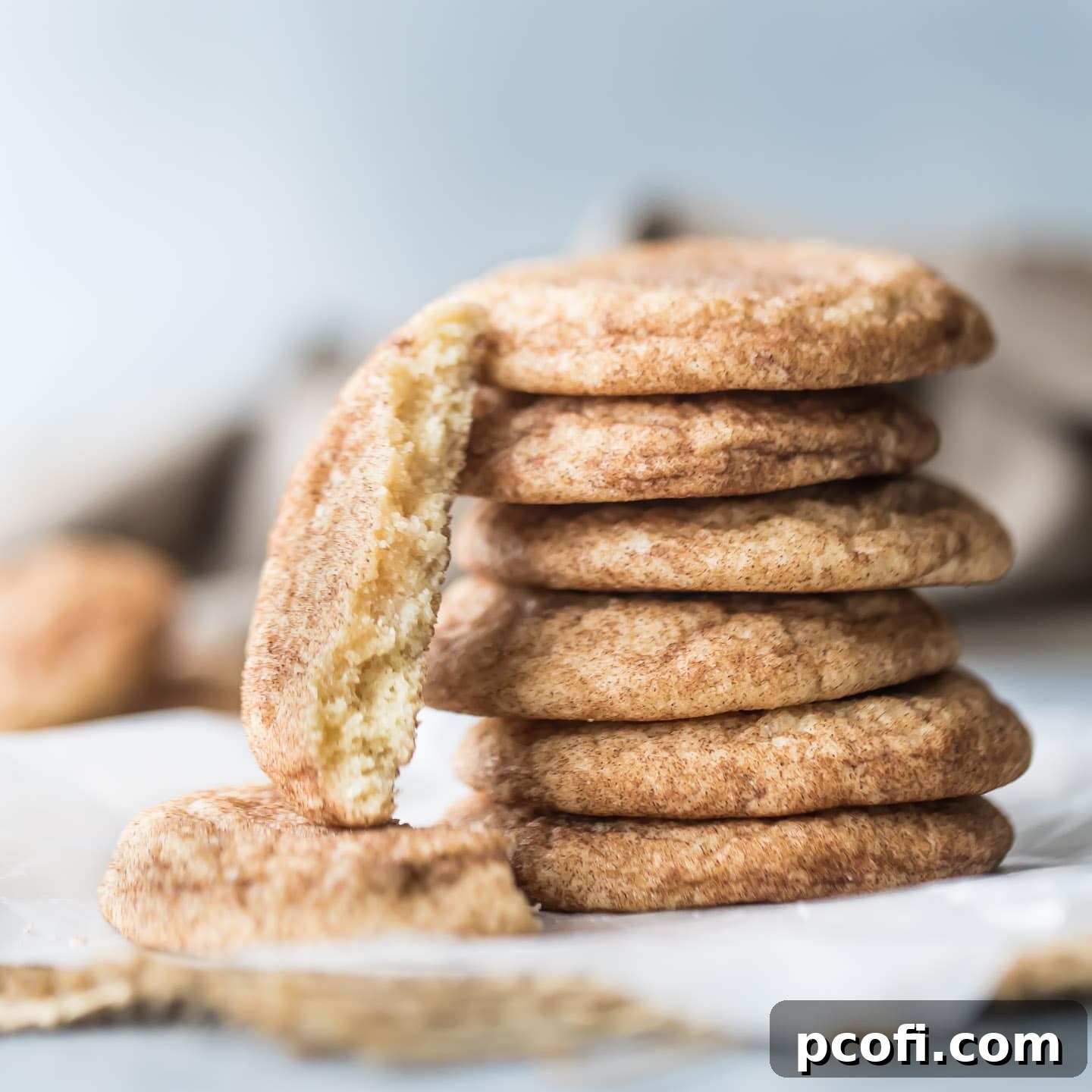 A delicious display of the Best Snickerdoodle Recipe, showcasing soft, thick, and perfectly cracked cookies dusted with cinnamon sugar.