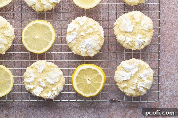 Lemon crinkle cookies on a cooling rack.