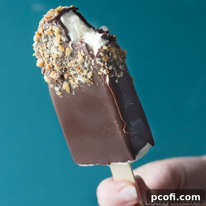 Delicious Toffee Almond Ice Cream Pop dipped in chocolate and garnished with nuts, ready for a summer treat