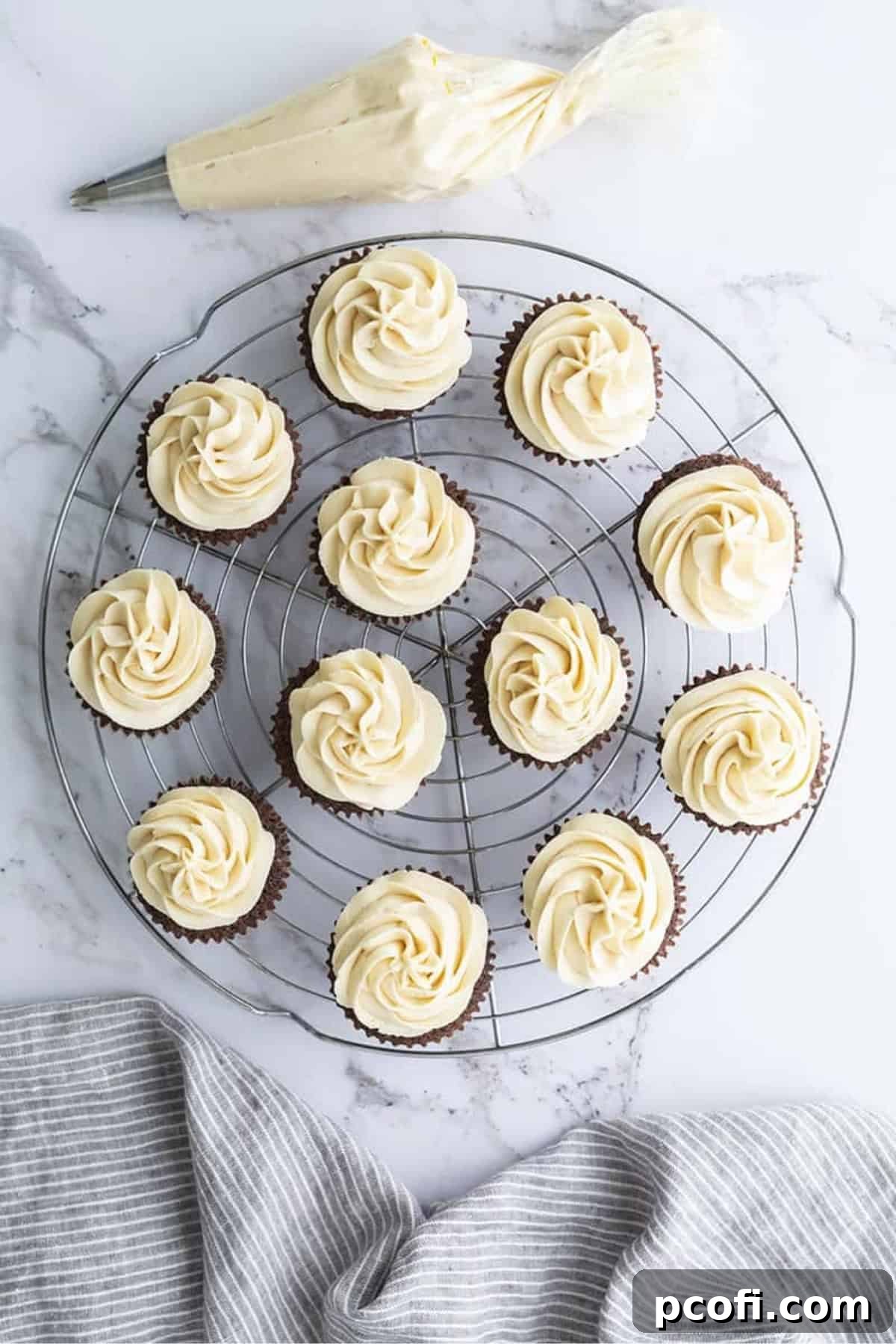 A beautifully frosted Irish cream cupcake with a decorative swirl of buttercream.