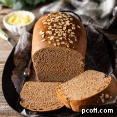 A slice of Outback Steakhouse bread with honey butter on a plate.