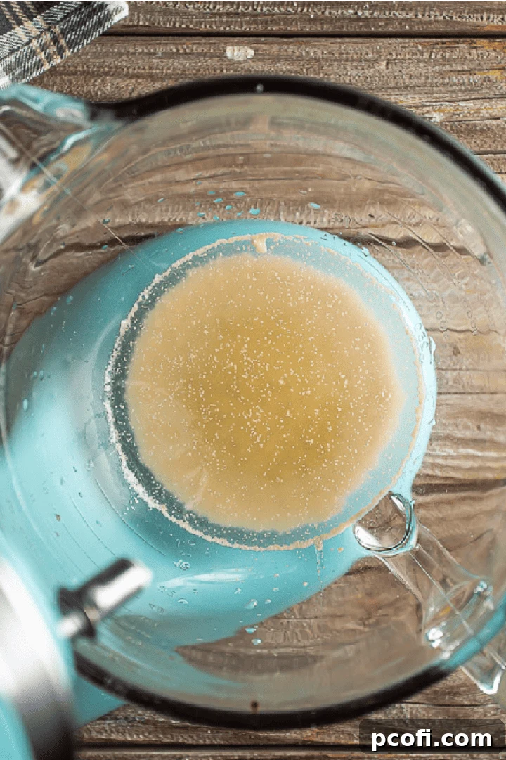 Dry active yeast dissolved and foamy in warm water with honey and molasses.