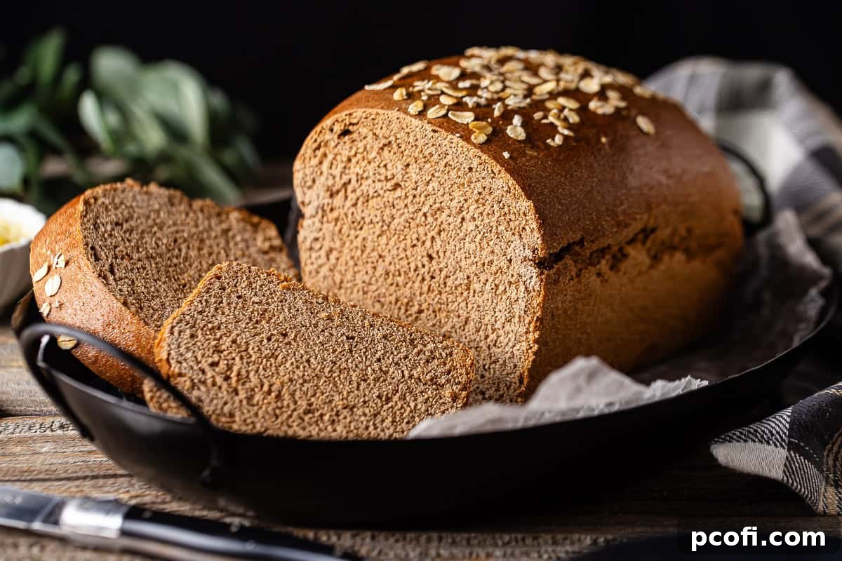 Recipe for Outback Steakhouse bread, prepared and presented on a platter with a plaid cloth in the background, sliced.