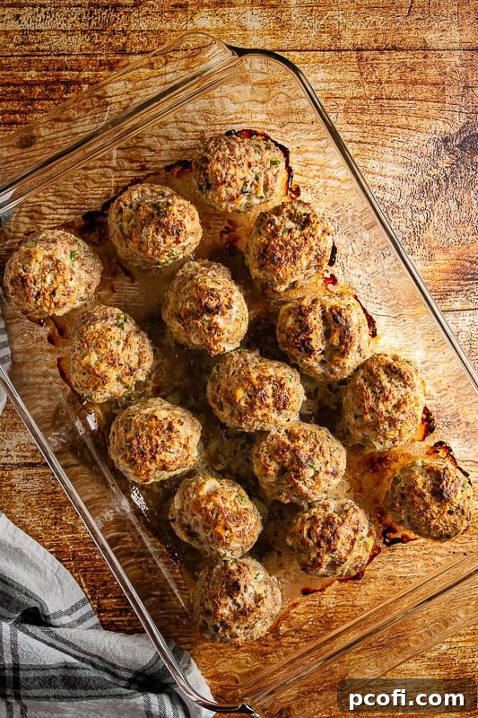 Step 4: Baked meatballs, golden brown and cooked through, are ready to be removed from the oven.