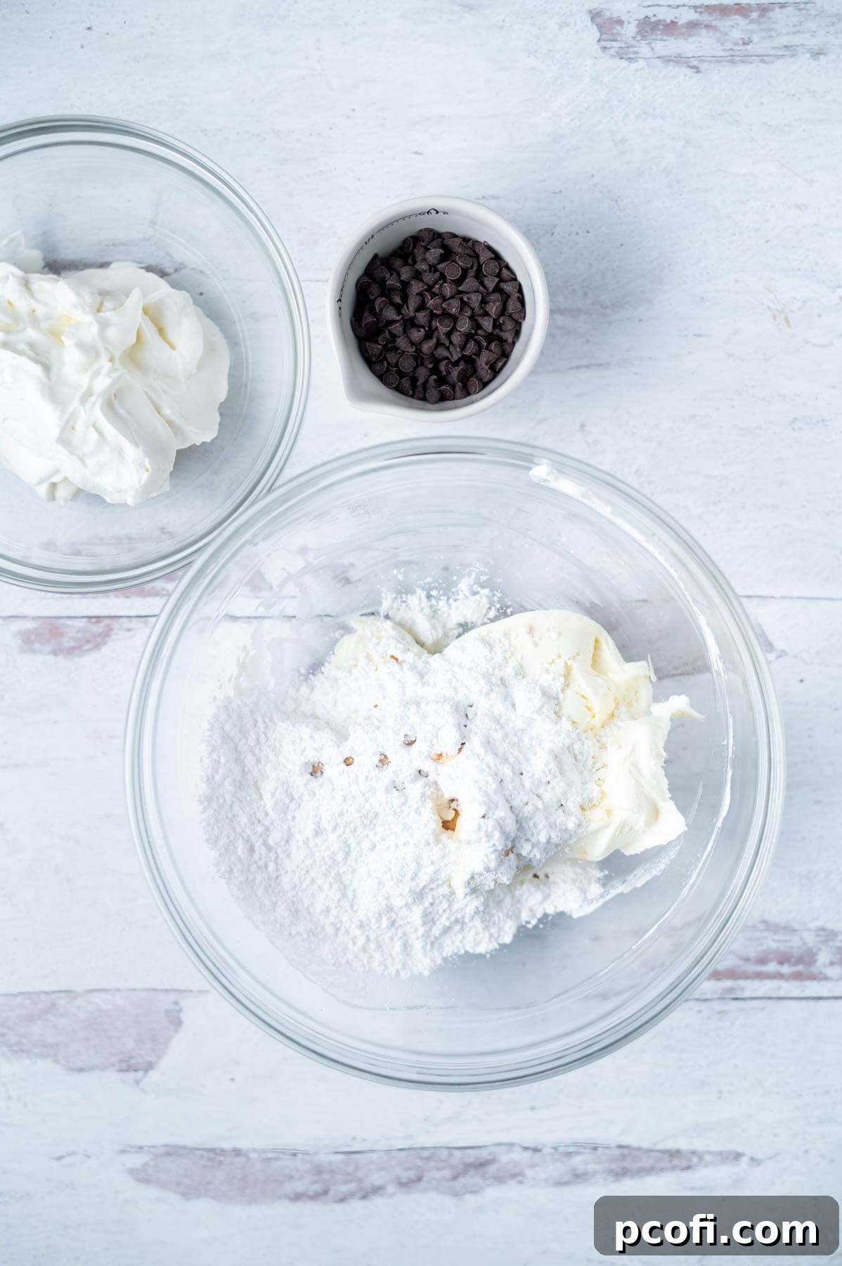 mascarpone, powdered sugar and vanilla in a glass mixing bowl