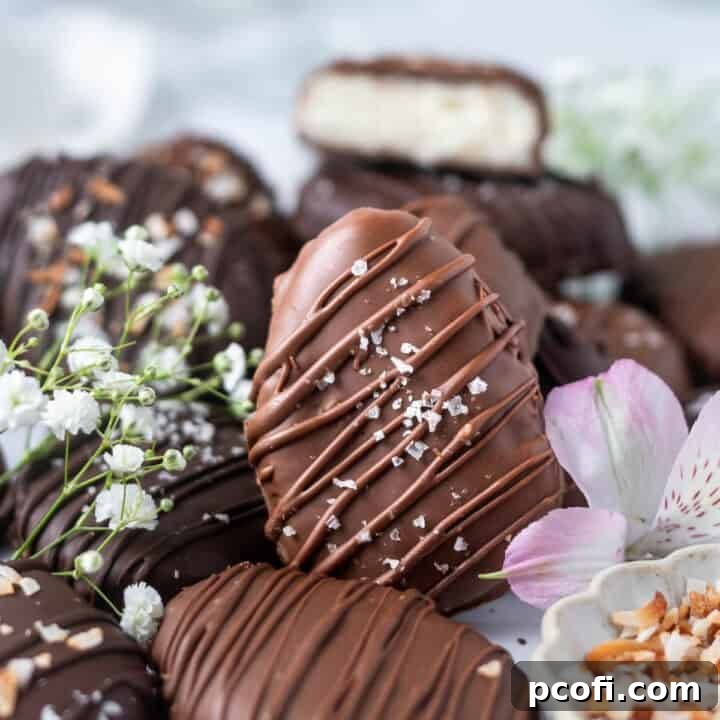 pile of coconut eggs with fresh flowers and a bowl of toasted coconut