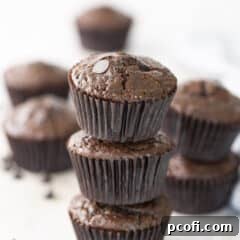 Delicious chocolate muffins stacked high, ready for serving.
