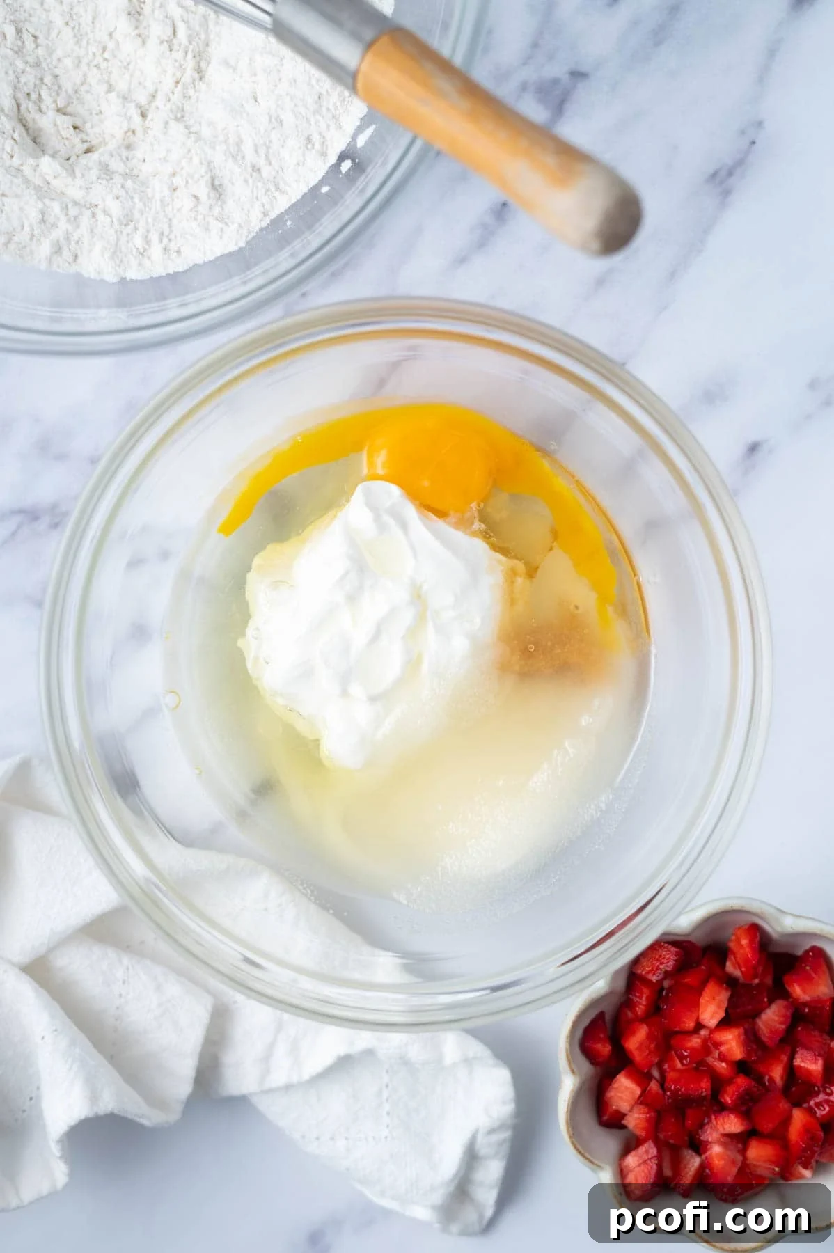 sugar, egg, sour cream and vanilla in a glass mixing bowl