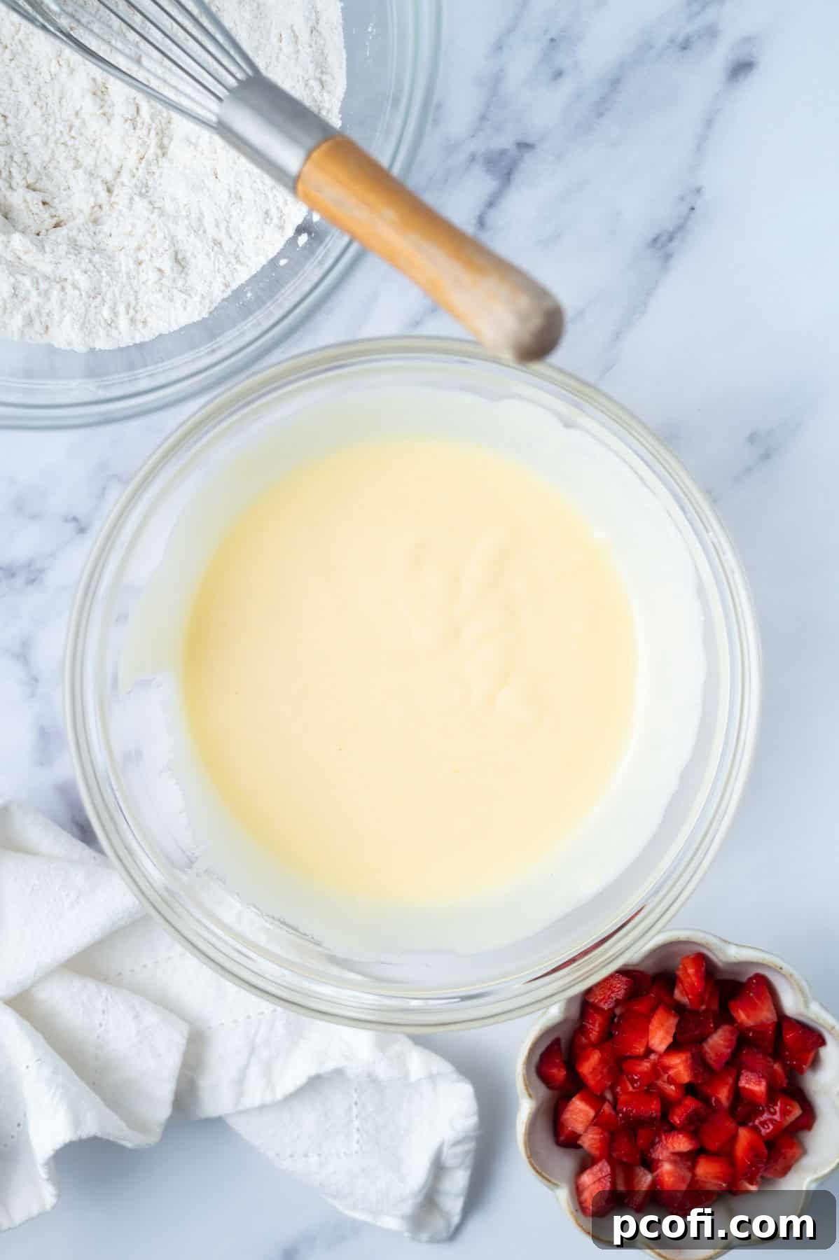 wet donut ingredients mixed in a mixing bowl