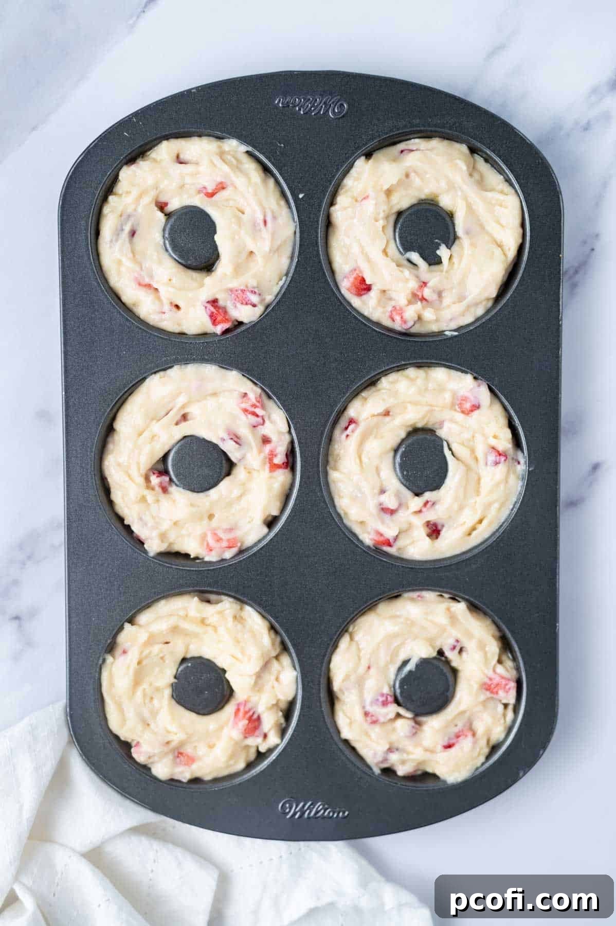 donut batter in a donut pan