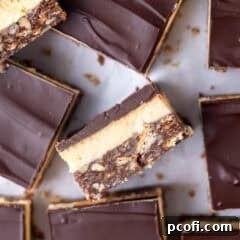 upclose look at the three layers of a no bake nanaiamo bar