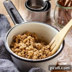 Streusel topping in a small enameled pot.